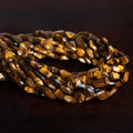 10x6mm Tiger Eye Faceted Ovals 14 inch 33 beads