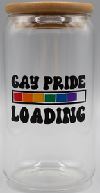 Glass jar with wooden lid and blue base, featuring 'GAY PRIDE LOADING' text and rainbow colors.