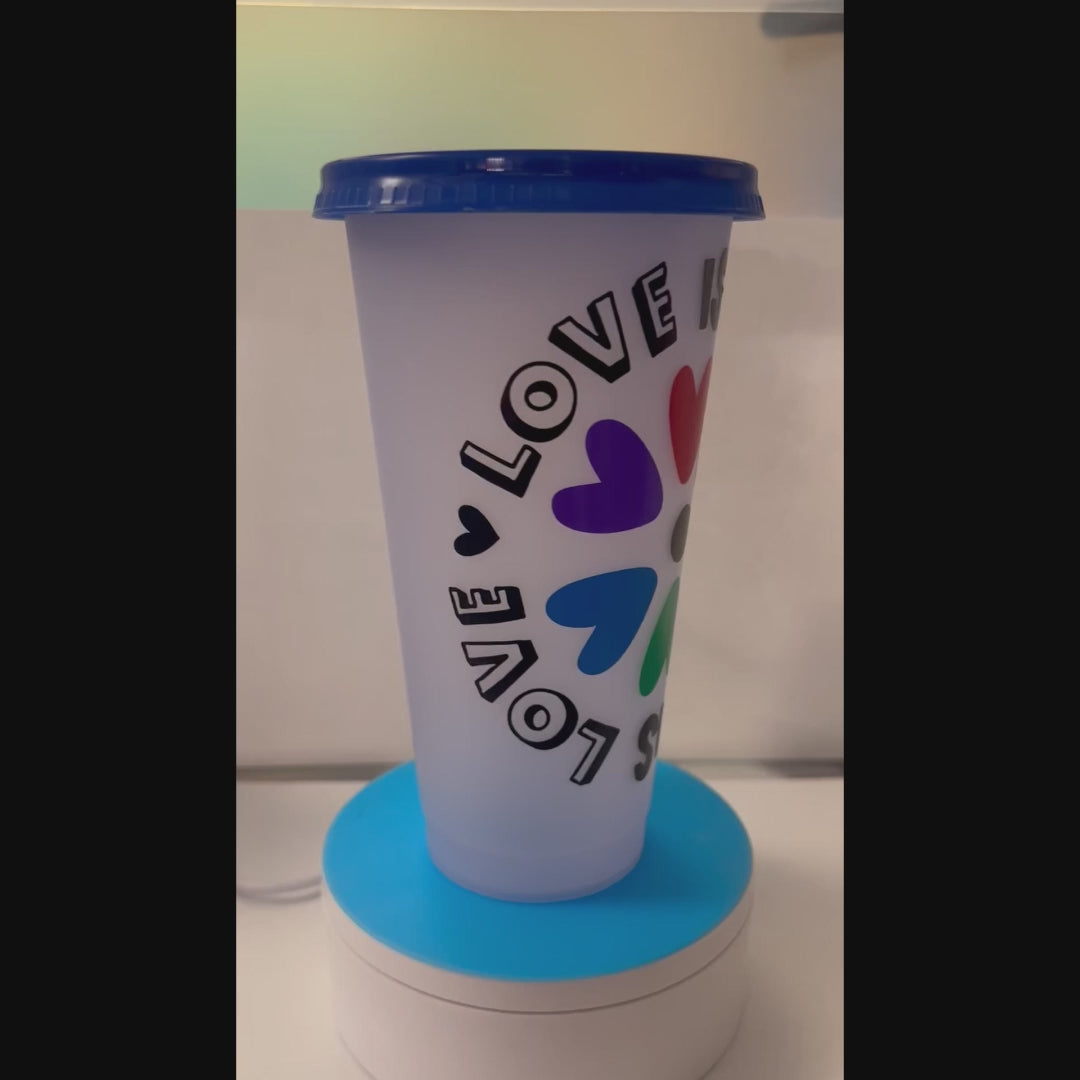 Tumbler with colorful heart design and 'LOVE IS LOVE'