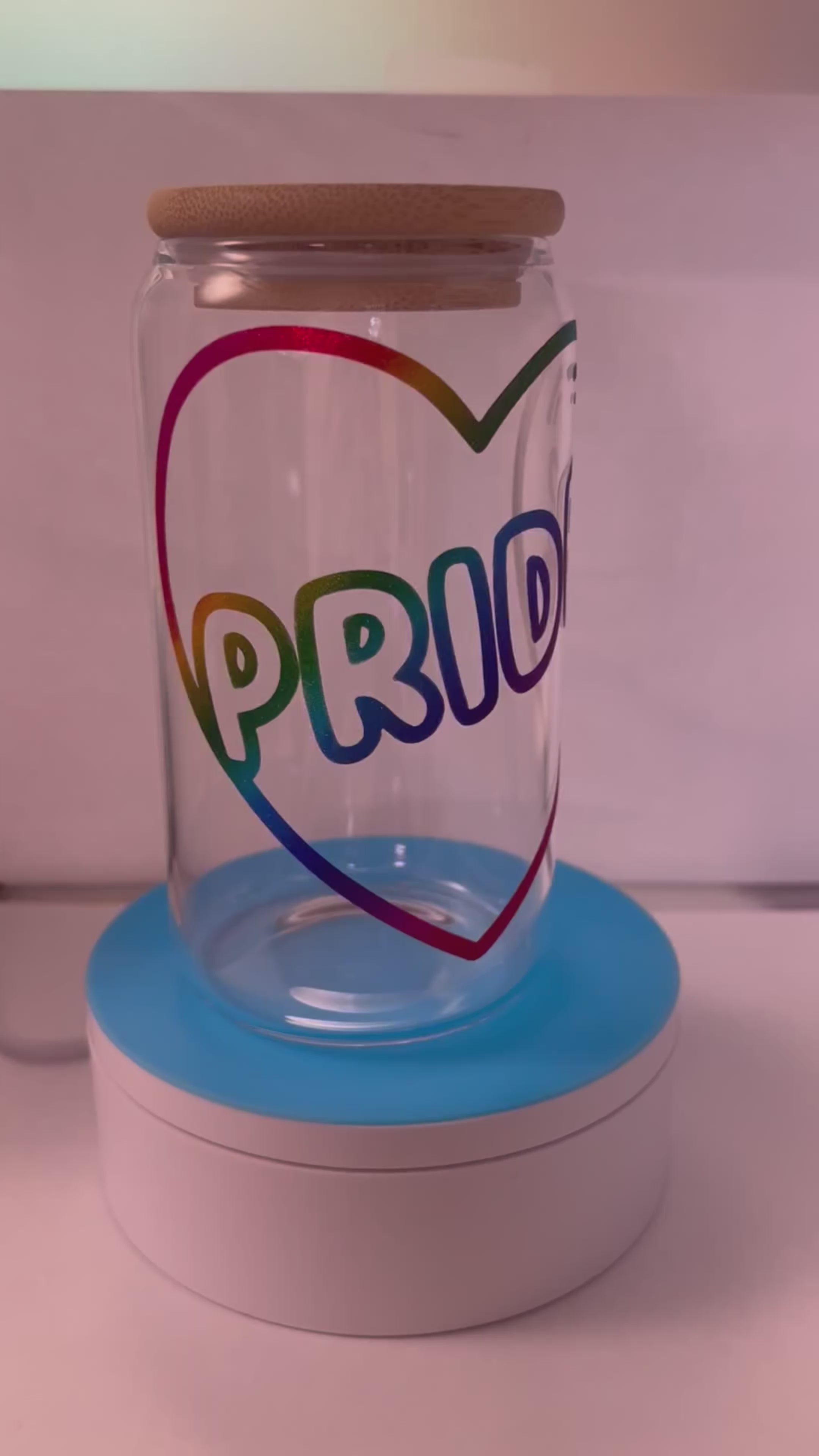 Pride text inside rainbow heart glass